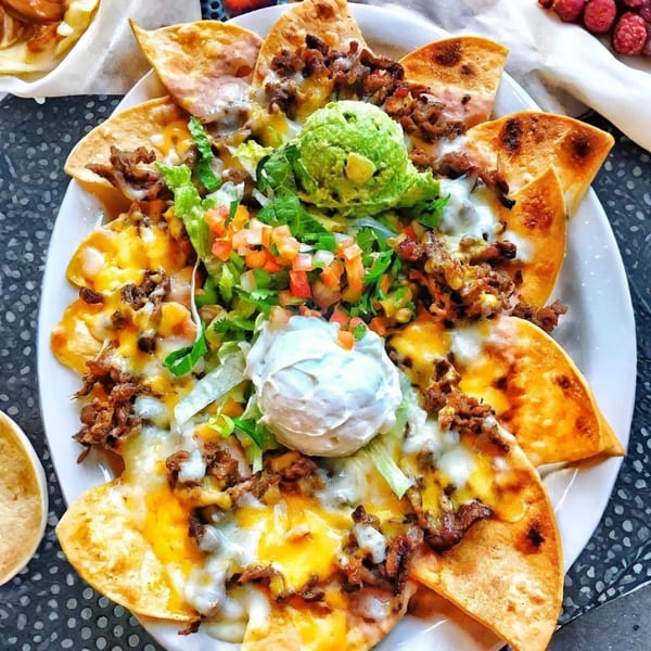 El Taquito's nachos with melted cheese, ground beef, guacamole, sour cream, and pico de gallo.